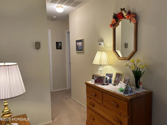 a bathroom with a sink toilet and a mirror