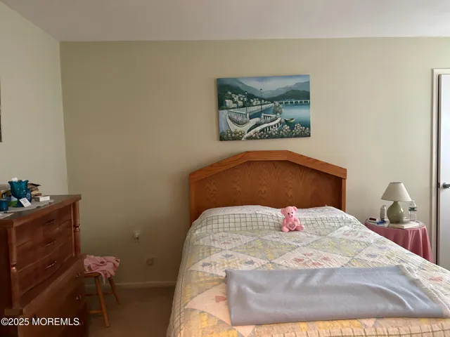 a bedroom with a bed and a table in it