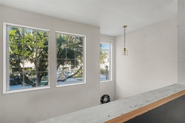 a bathroom with a window and a view of lake