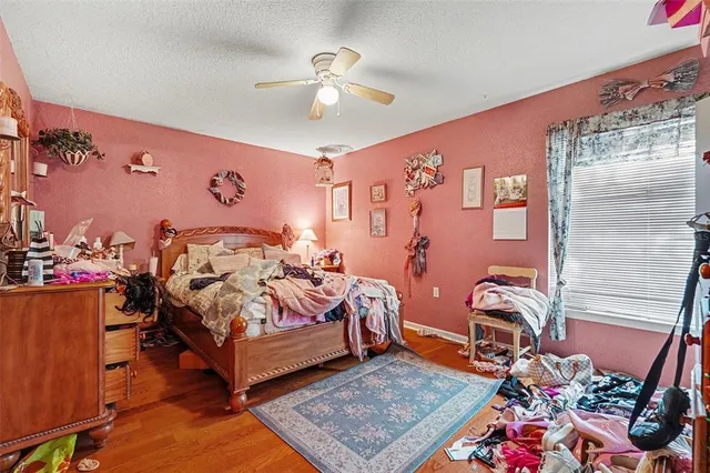 a bedroom with bed and a window