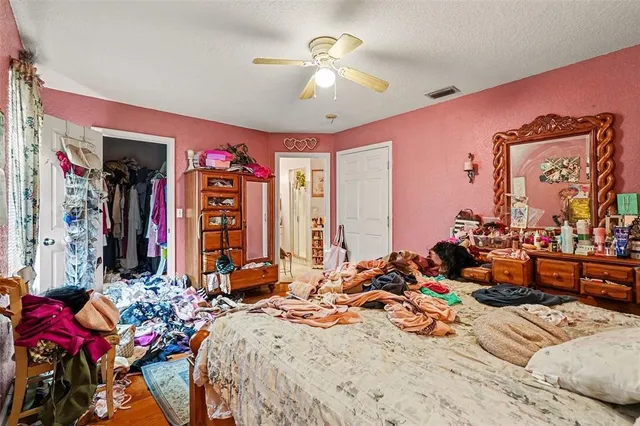 a bed room with a bed and a chandelier