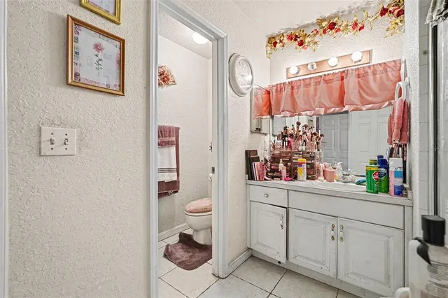 a kitchen with a refrigerator and a sink