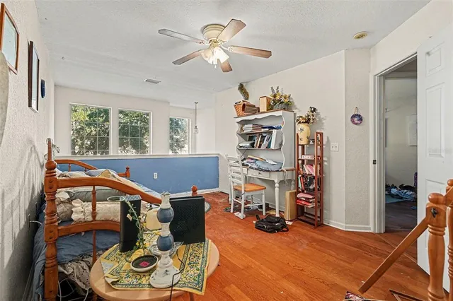 a view of a room with furniture and a chandelier