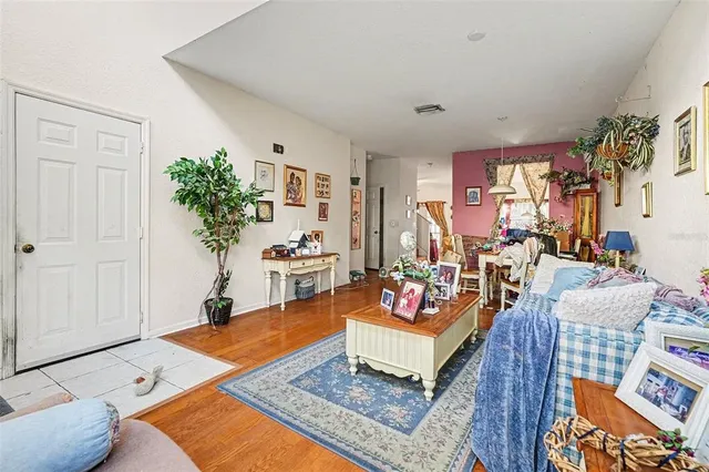a living room with furniture and a rug