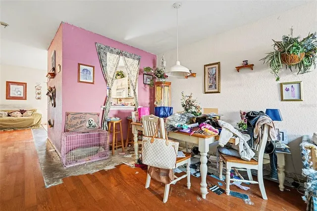 a view of a livingroom with furniture and a flat screen tv