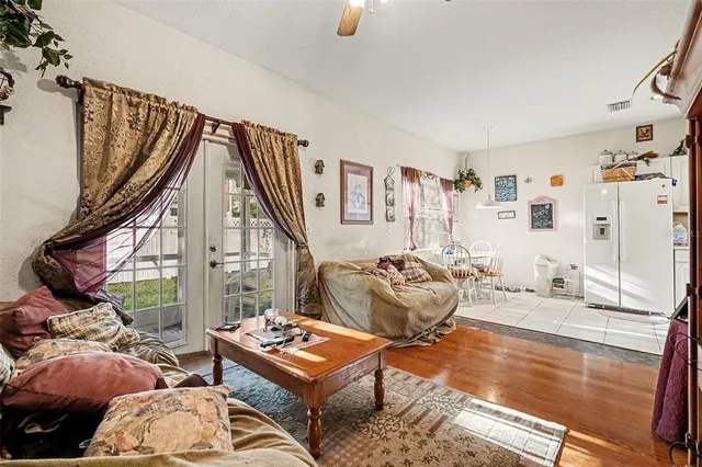 a bedroom with furniture and a large window