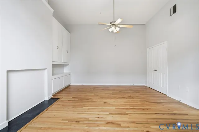 a view of a room with wooden floor and closet