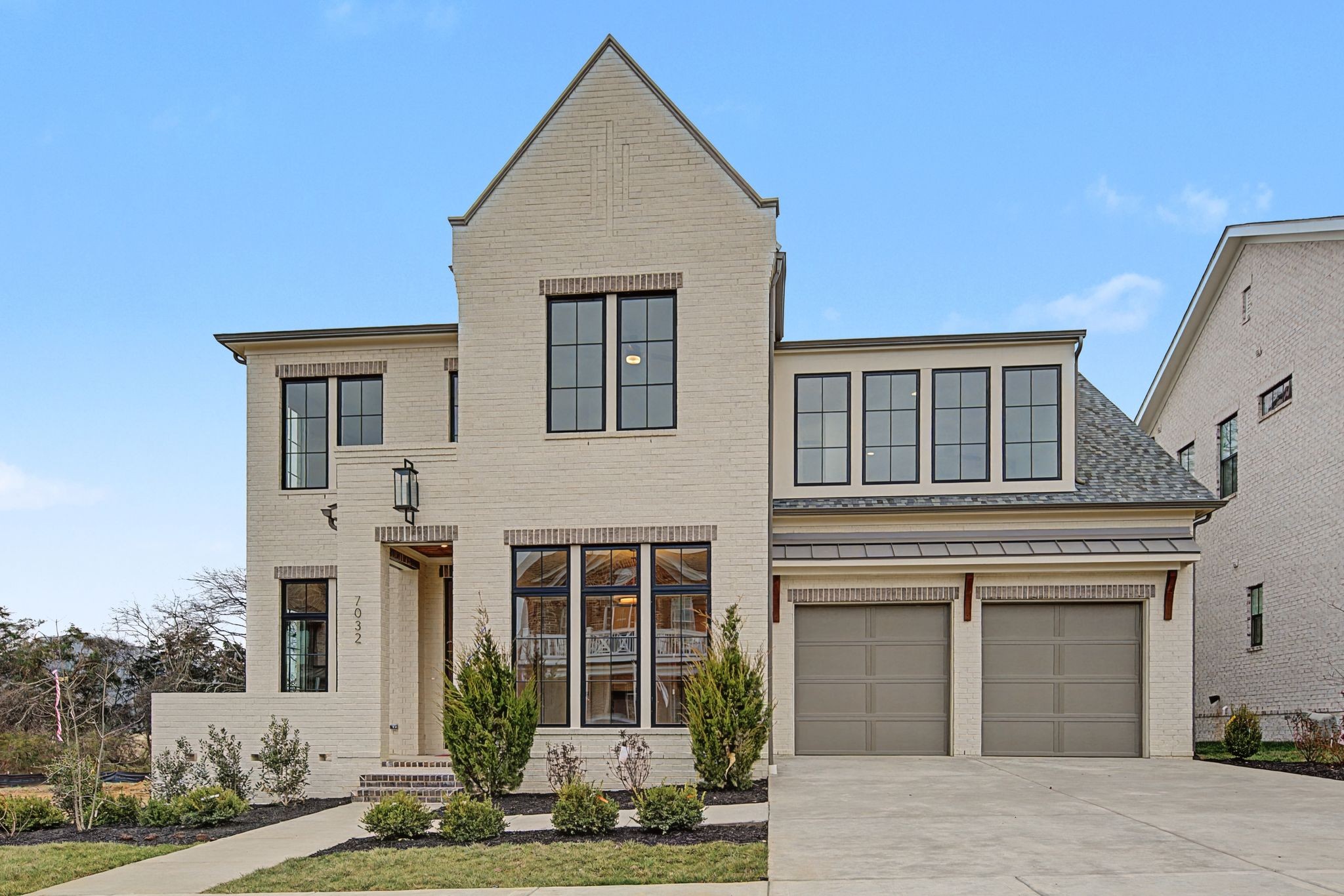 7032 Kinderhook Road Nashville, TN 37221 - Photo 2 of 91 a front view of a house with a yard