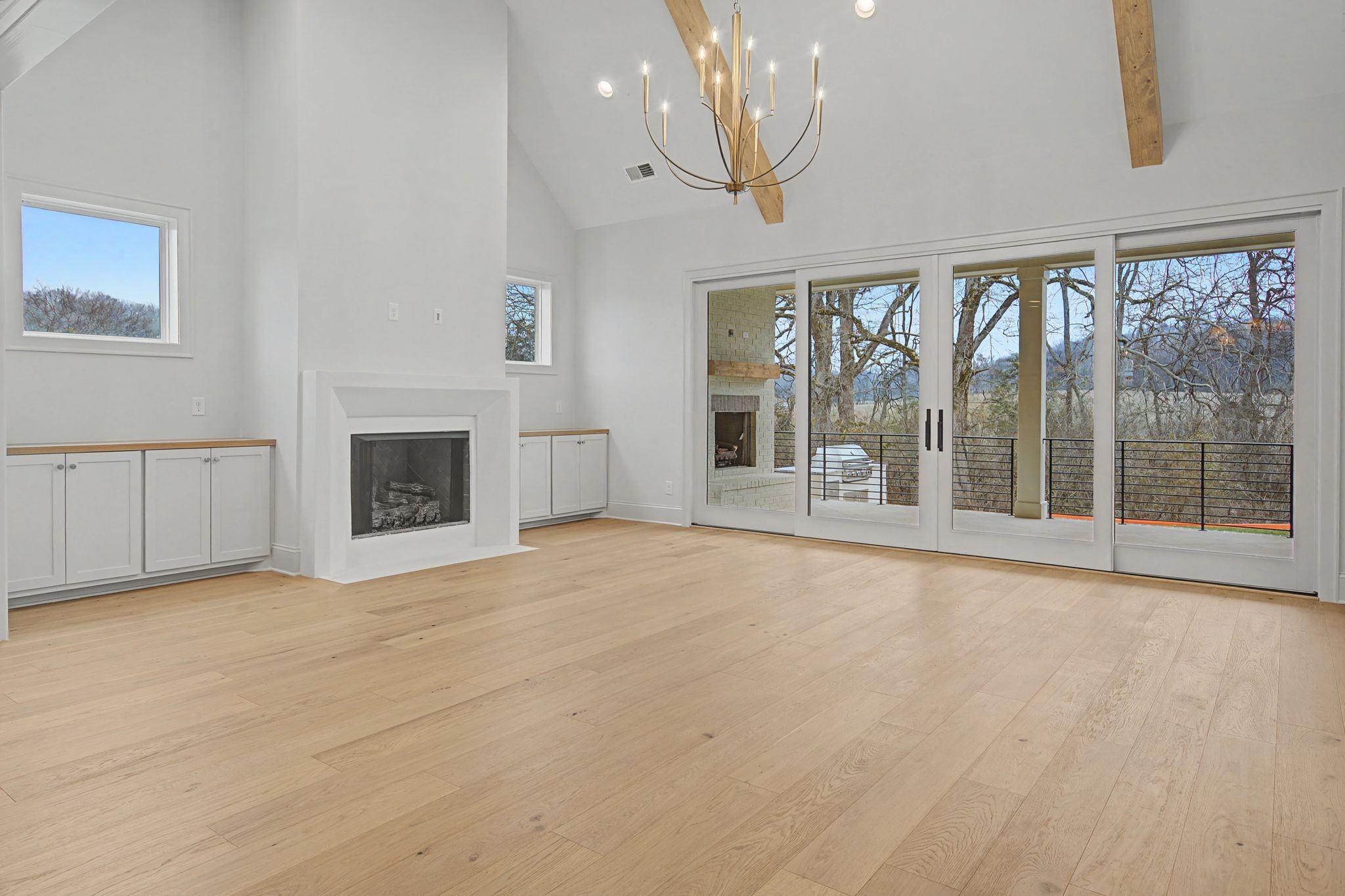 7032 Kinderhook Road Nashville, TN 37221 - Photo 25 of 91 a view of an empty room with a fireplace and a window