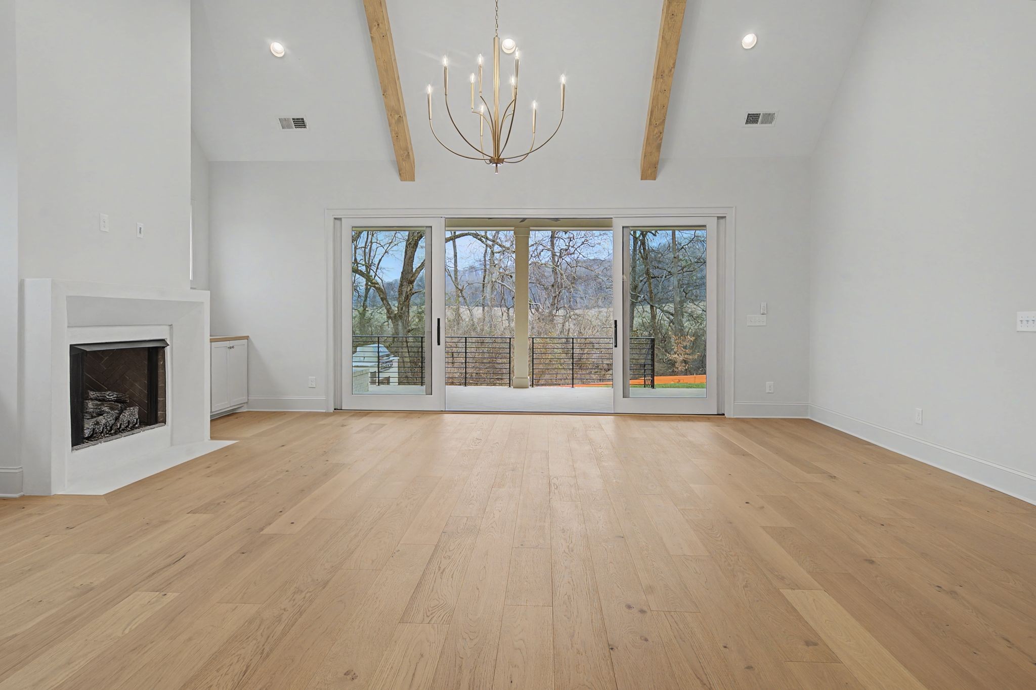 7032 Kinderhook Road Nashville, TN 37221 - Photo 28 of 91 a view of an empty room with a fireplace and a window
