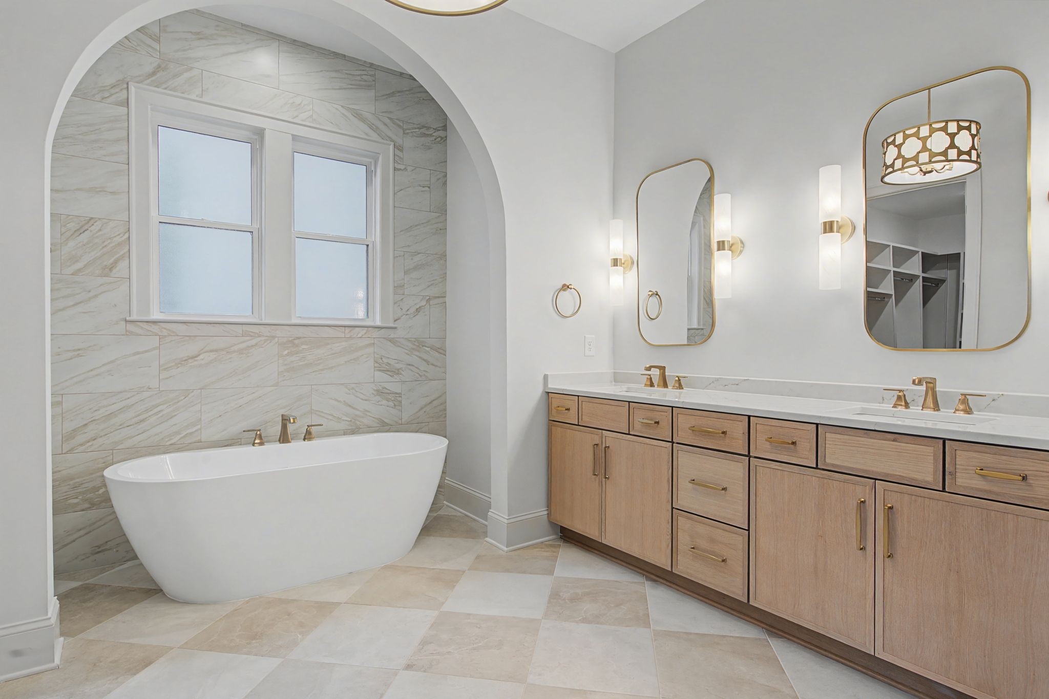 7032 Kinderhook Road Nashville, TN 37221 - Photo 33 of 91 a spacious bathroom with a double vanity sink mirror and bathtub