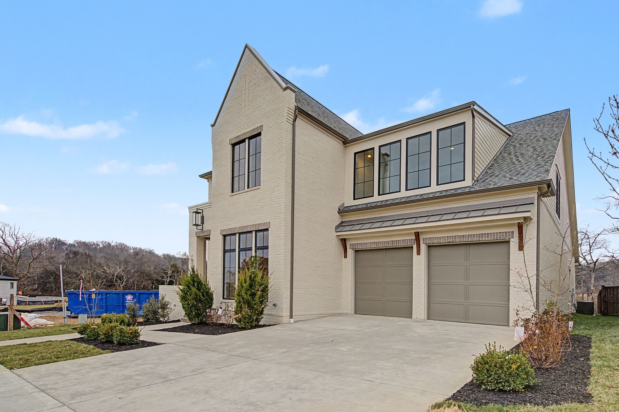 7032 Kinderhook Road Nashville, TN 37221 - Photo 4 of 91 a front view of a house with a yard and garage