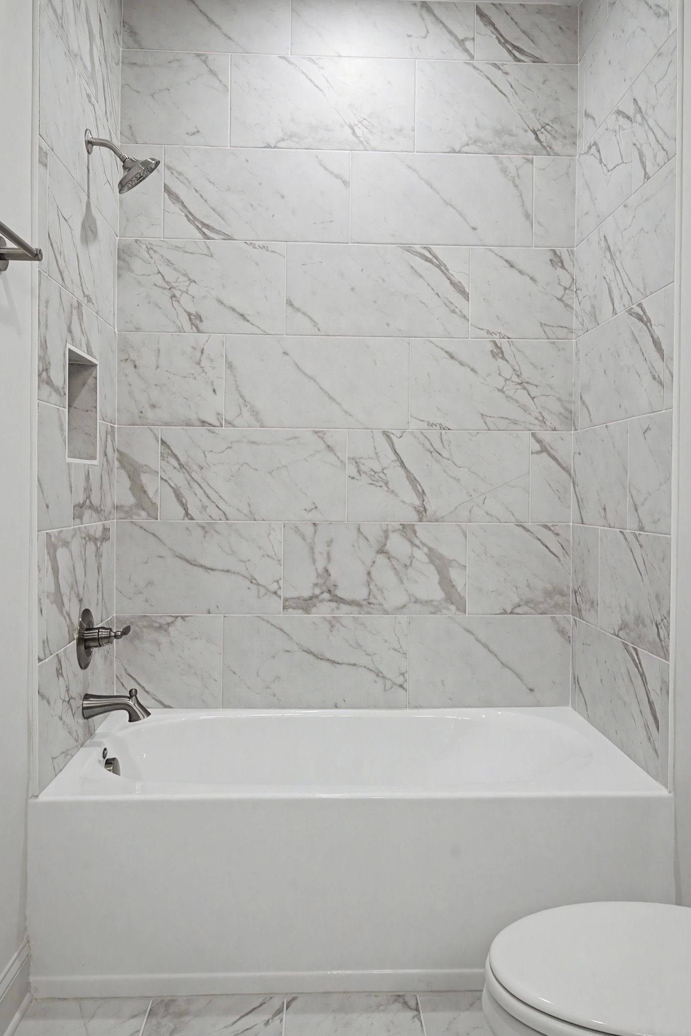 7032 Kinderhook Road Nashville, TN 37221 - Photo 48 of 91 a bathroom with a toilet and a bathtub