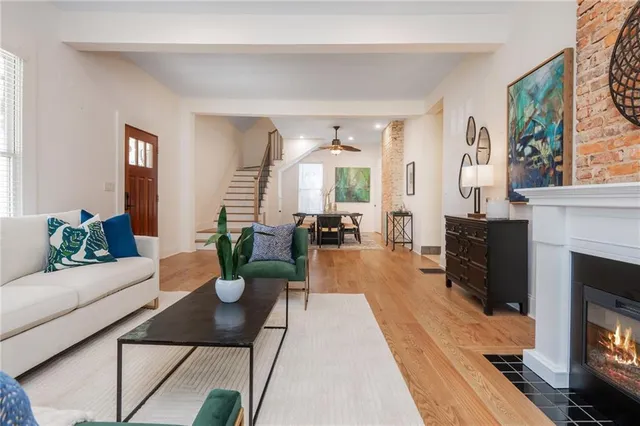 a view of a livingroom with furniture and wooden floor