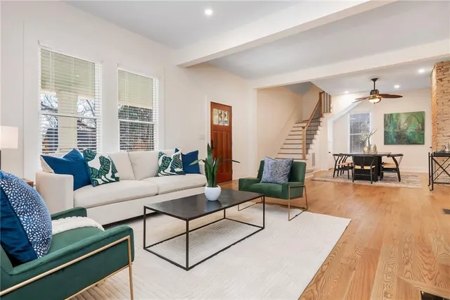 a view of a dining room with furniture and a chandelier