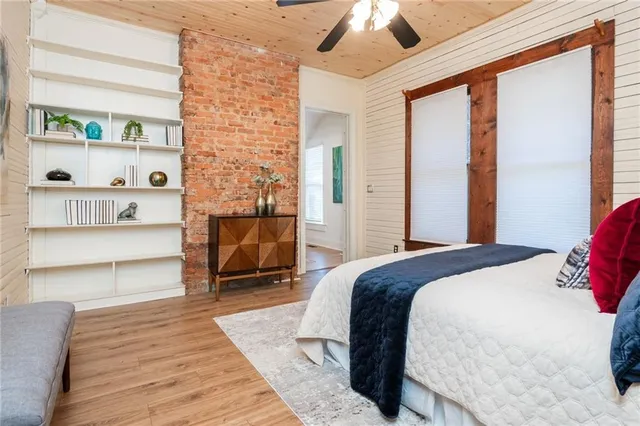 a bedroom with furniture and a rug