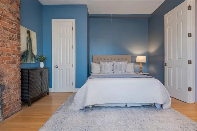 a kitchen with refrigerator and cabinets