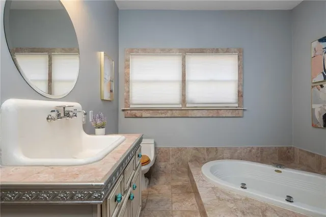 a kitchen with stainless steel appliances granite countertop a stove and a refrigerator