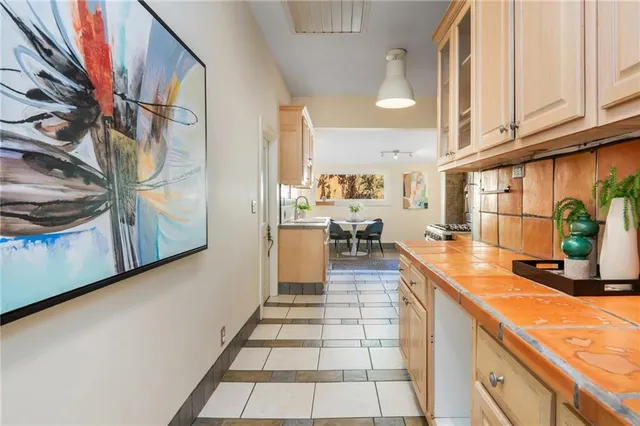 a kitchen with stainless steel appliances stove top oven and cabinets