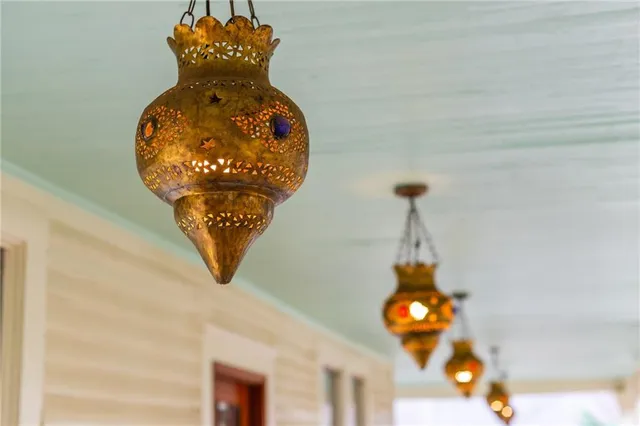 a bathroom with a granite countertop bathtub shower and toilet