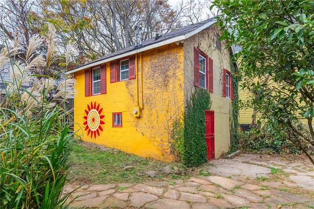 a kitchen with granite countertop wooden cabinets and a sink