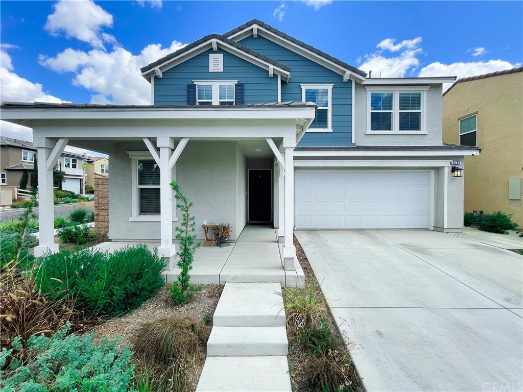 9792 Solonia Street Riverside, CA 92503 - Photo 1 of 1 a front view of a house with garden