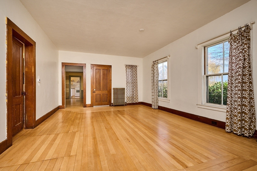 41 Coombs Hill Road Colrain, MA 01340 - Photo 15 of 32 a view of an empty room with wooden floor and a window
