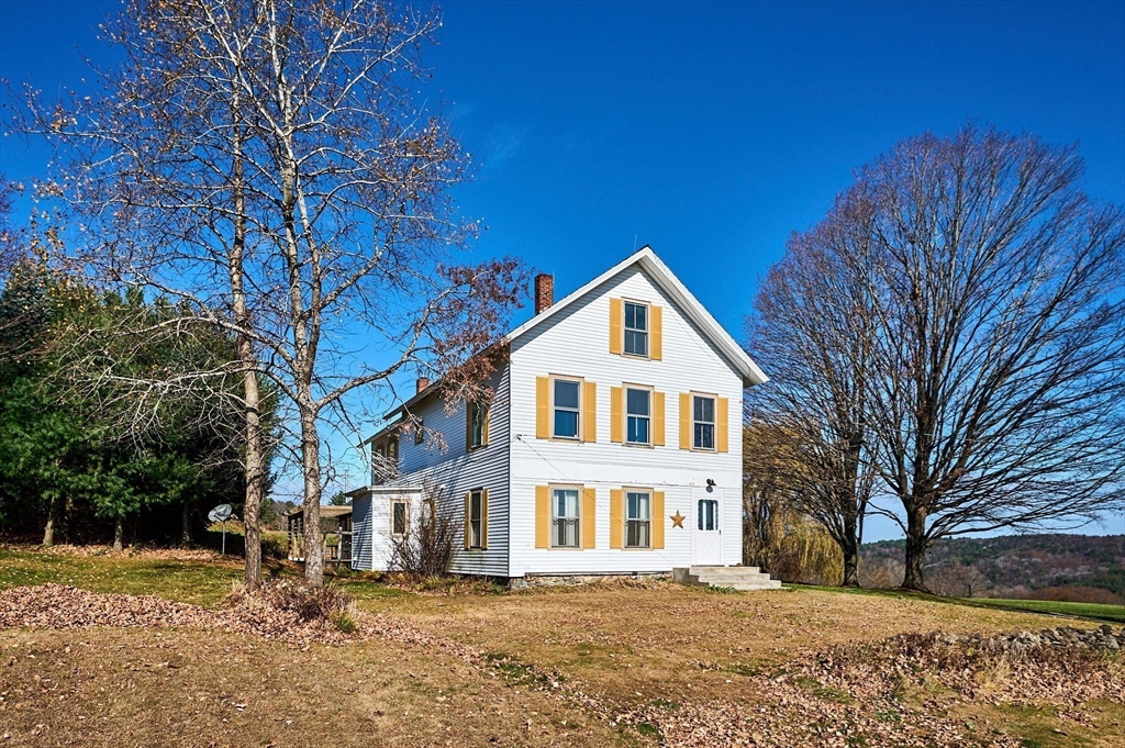 41 Coombs Hill Road Colrain, MA 01340 - Photo 5 of 32 a front view of a house with a yard