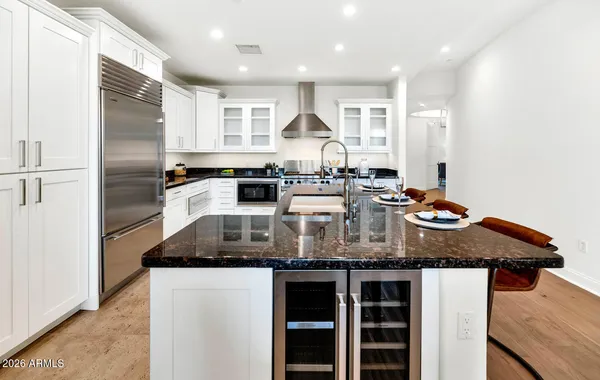 a kitchen with a stove and a refrigerator