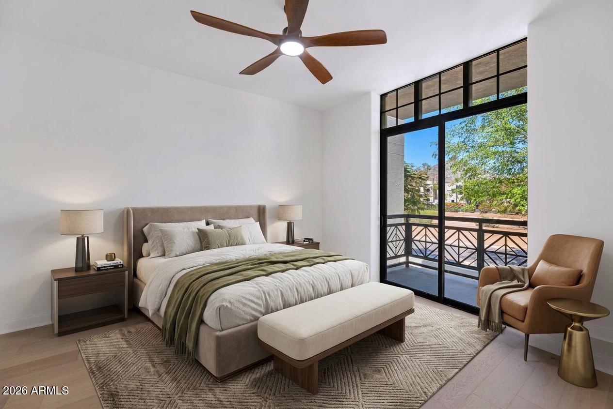8 Biltmore Estate, Unit 209 Phoenix, AZ 85016 - Photo 29 of 49 a spacious bedroom with a bed and a couch