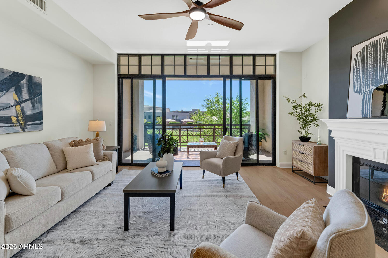 8 Biltmore Estate, Unit 209 Phoenix, AZ 85016 - Photo 2 of 49 a living room with furniture fireplace and a large window