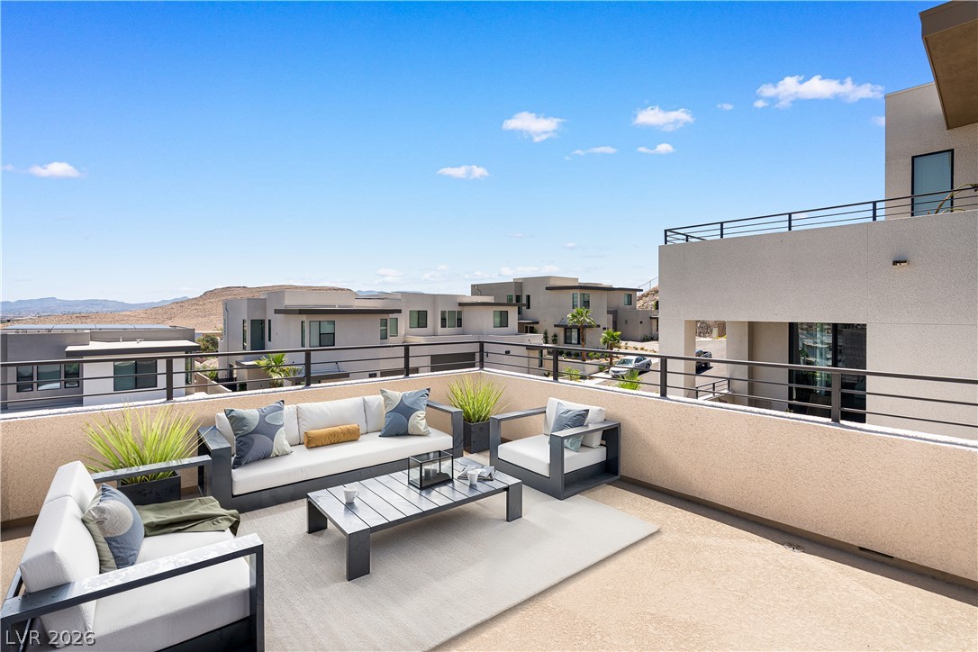 11027 Socrates Ridge Street Las Vegas, NV 89141 - Photo 6 of 20 A spacious rooftop deck provides elevated outdoor living with views of the surrounding community.