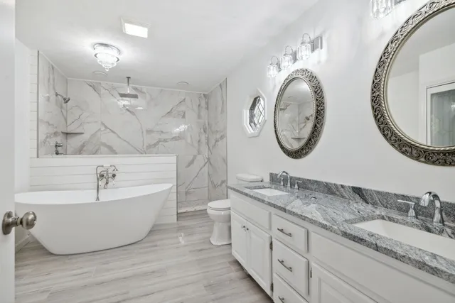 a bathroom with a double vanity sink and a mirror
