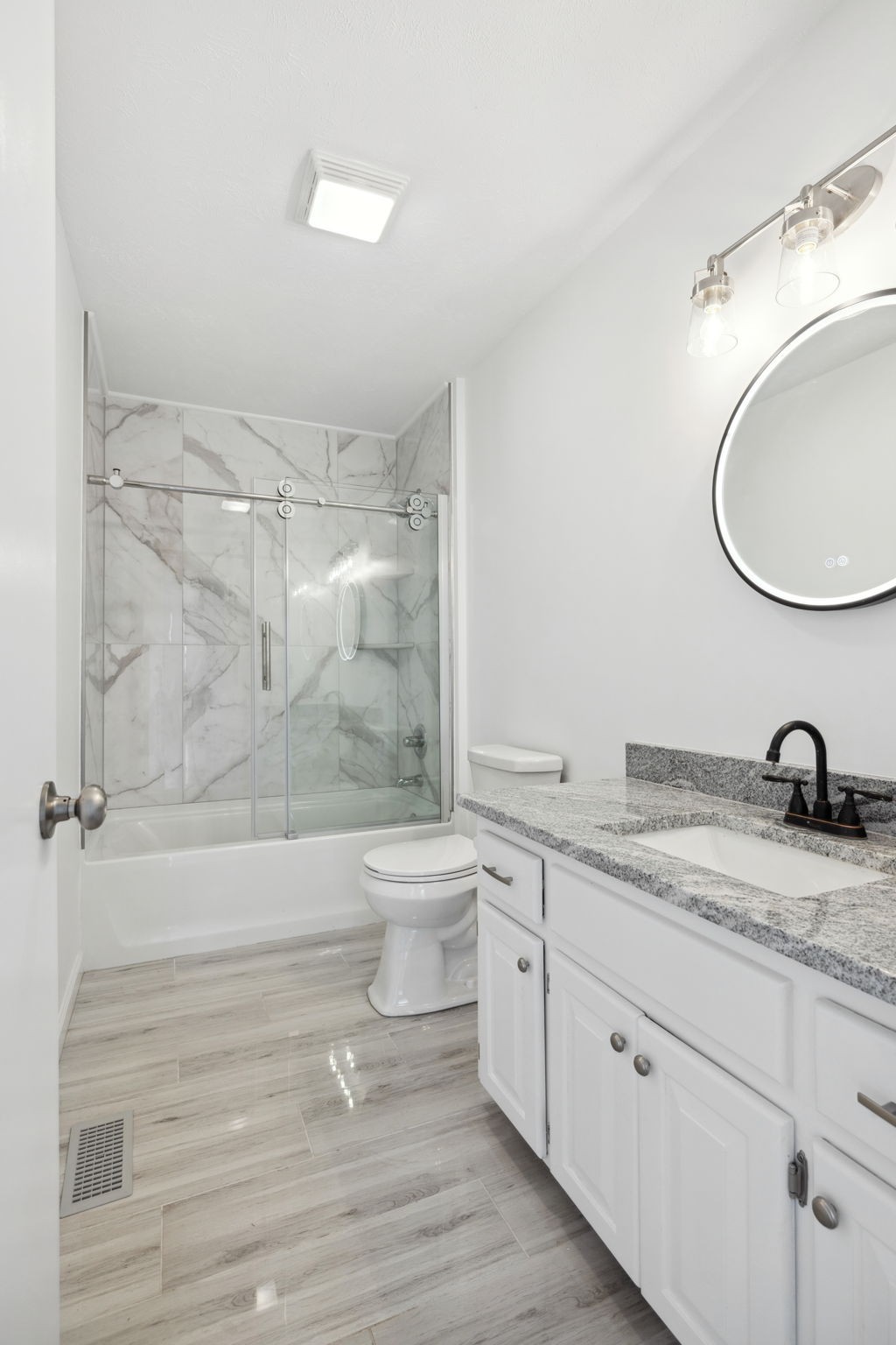 500 Brown Road Bon Aqua, TN 37025 - Photo 14 of 35 a bathroom with a granite countertop sink toilet a mirror and shower