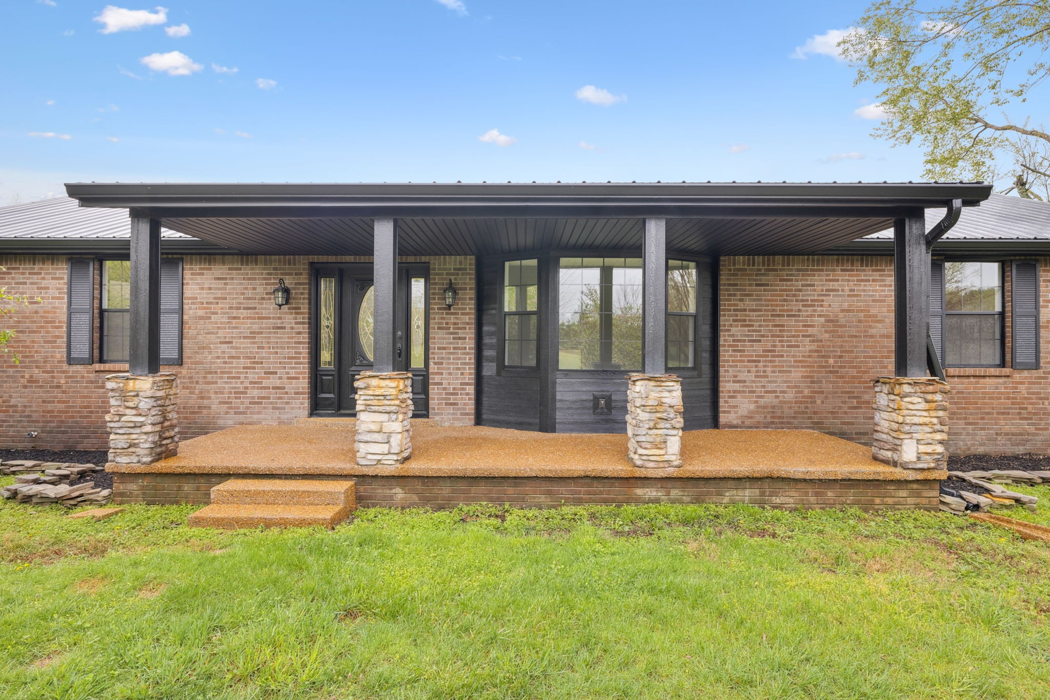 500 Brown Road Bon Aqua, TN 37025 - Photo 2 of 35 front view of a house with a patio