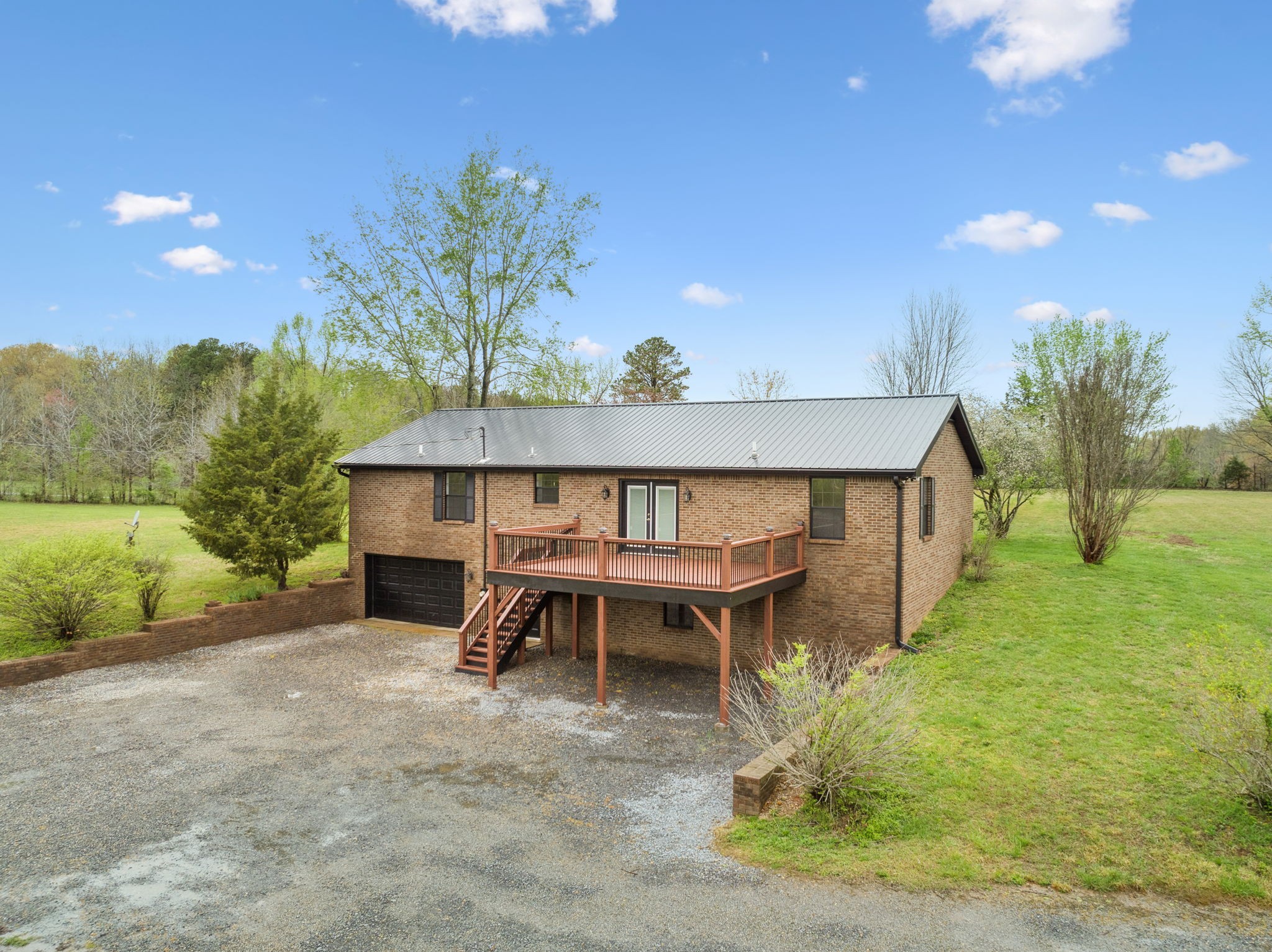 500 Brown Road Bon Aqua, TN 37025 - Photo 24 of 35 a view of a house with a yard and sitting area