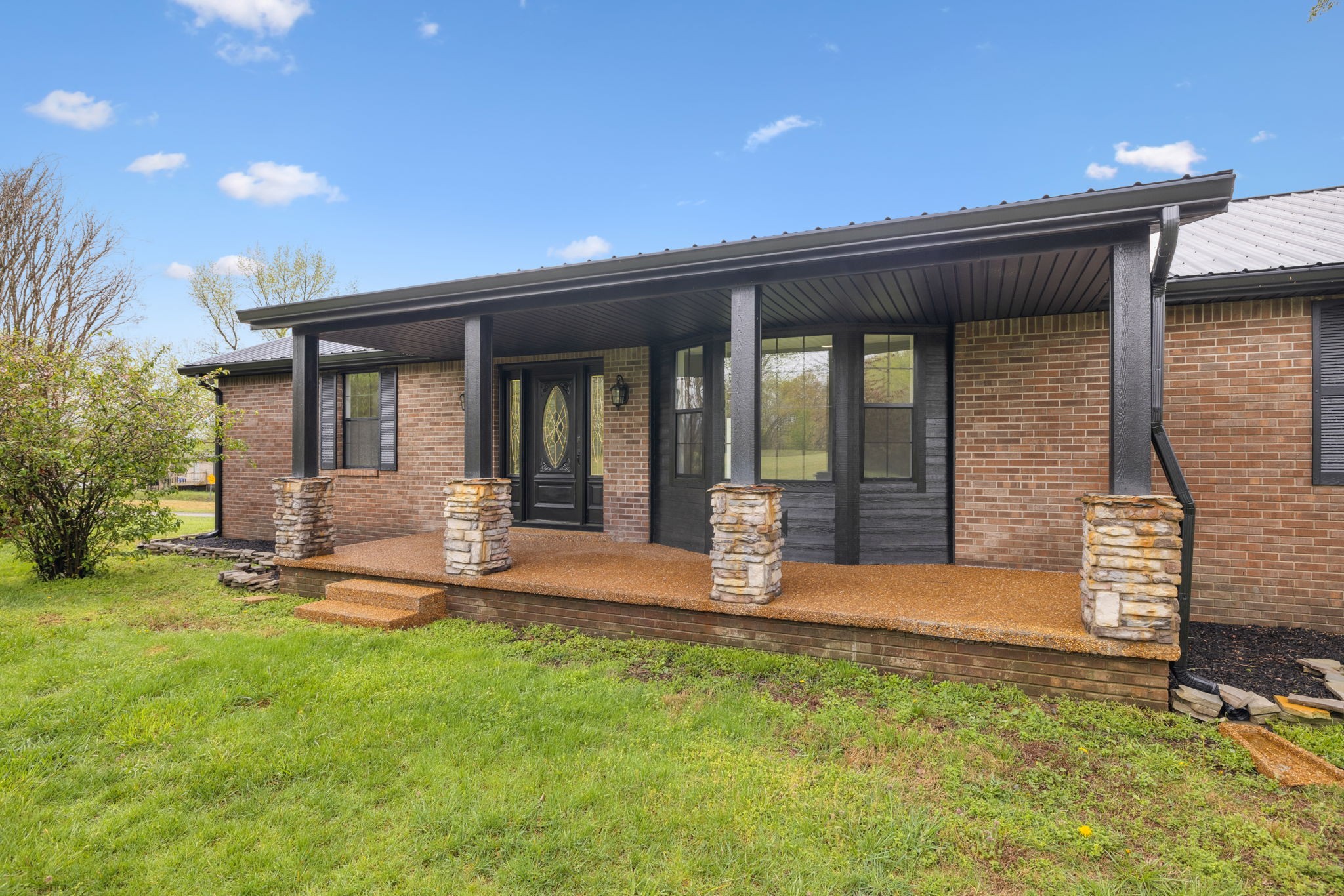 500 Brown Road Bon Aqua, TN 37025 - Photo 3 of 35 a front view of a house with garden