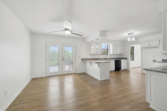 a view of kitchen with wooden floor and a kitchen