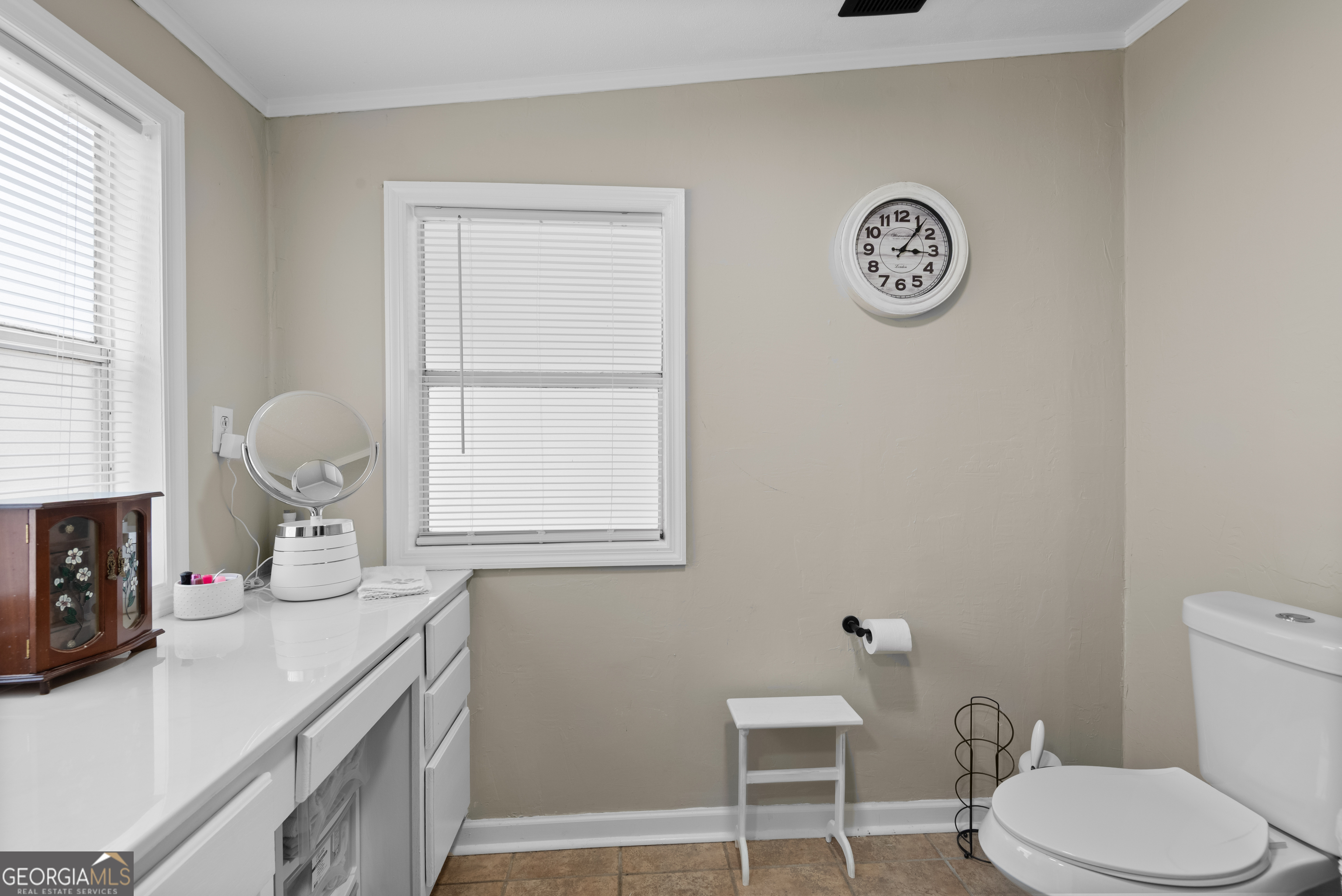 1706 Stark Road Jackson, GA 30233 - Photo 25 of 38 a bathroom with a toilet a sink and mirror