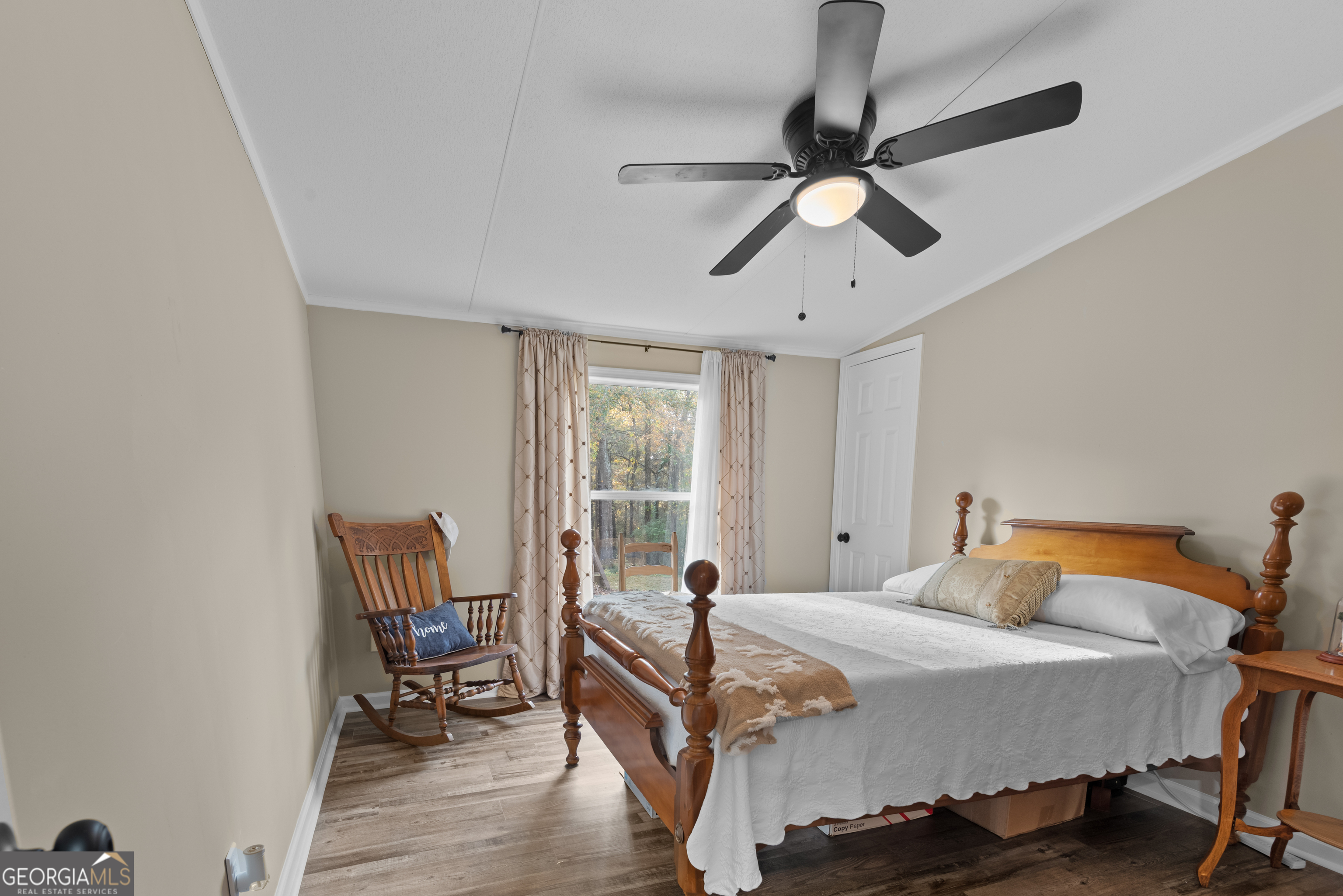 1706 Stark Road Jackson, GA 30233 - Photo 28 of 38 a bedroom with a bed a chair and the potted plant