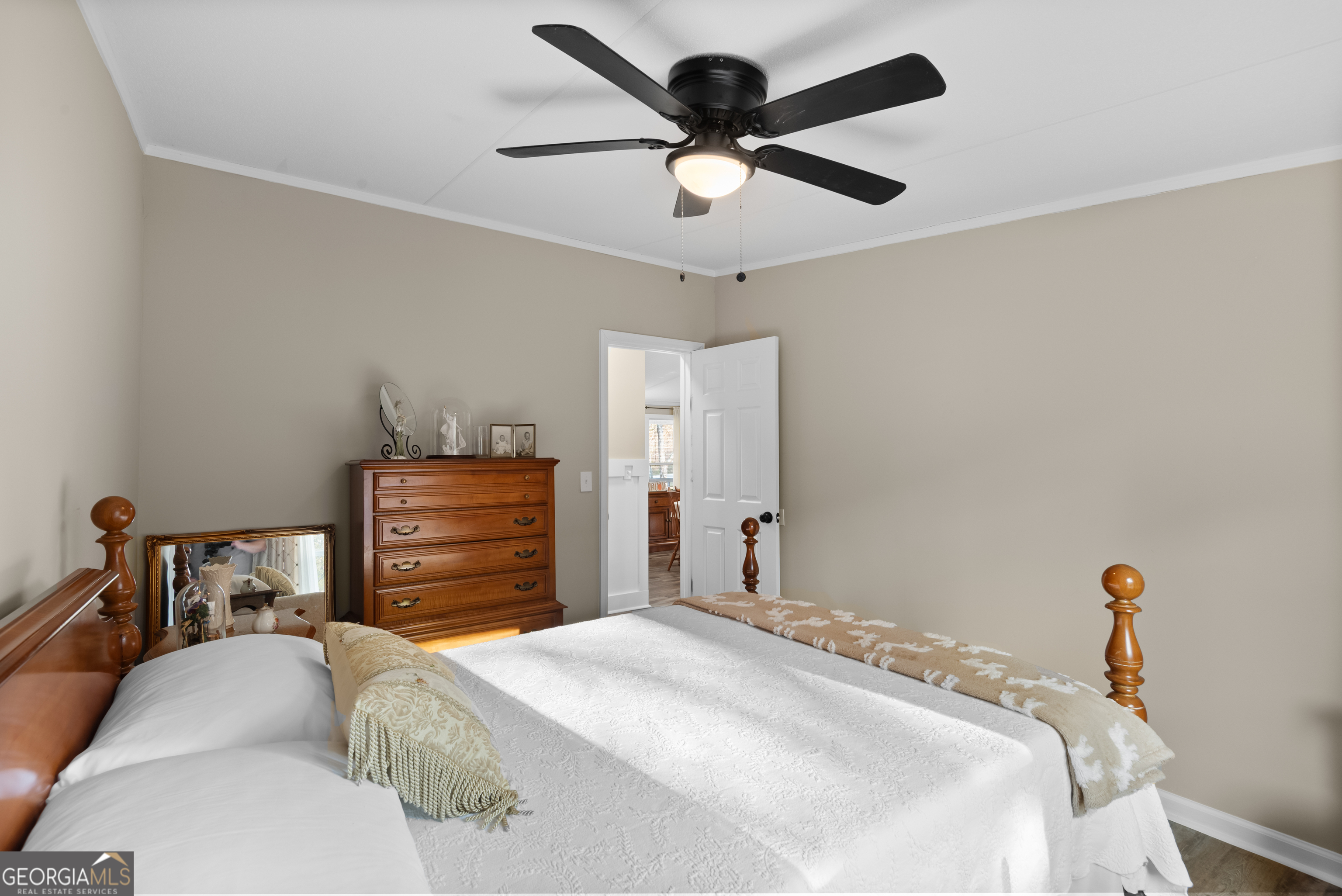 1706 Stark Road Jackson, GA 30233 - Photo 29 of 38 a bedroom with a bed and a chandelier