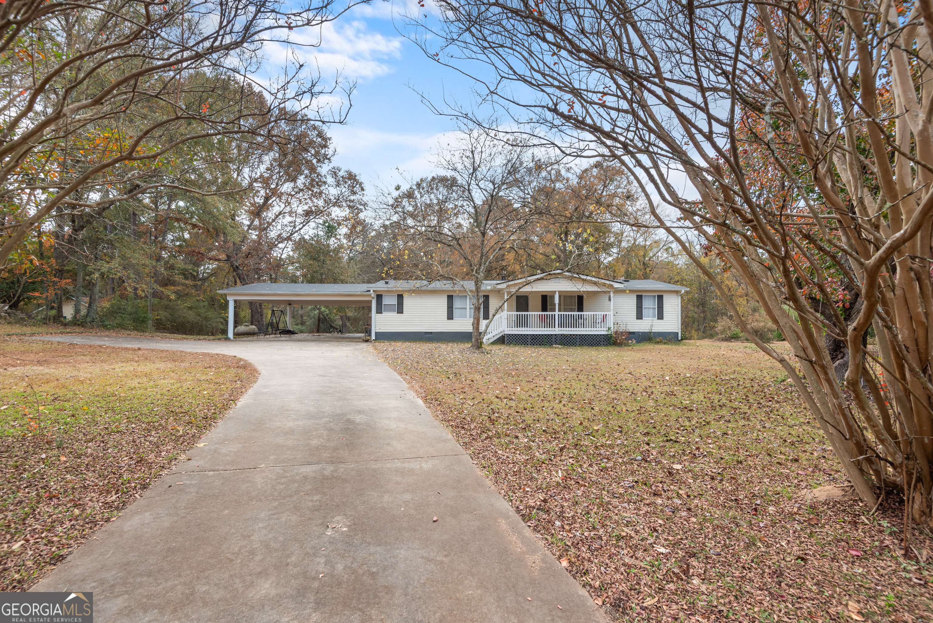 1706 Stark Road Jackson, GA 30233 - Photo 3 of 38 a house with trees in front of it