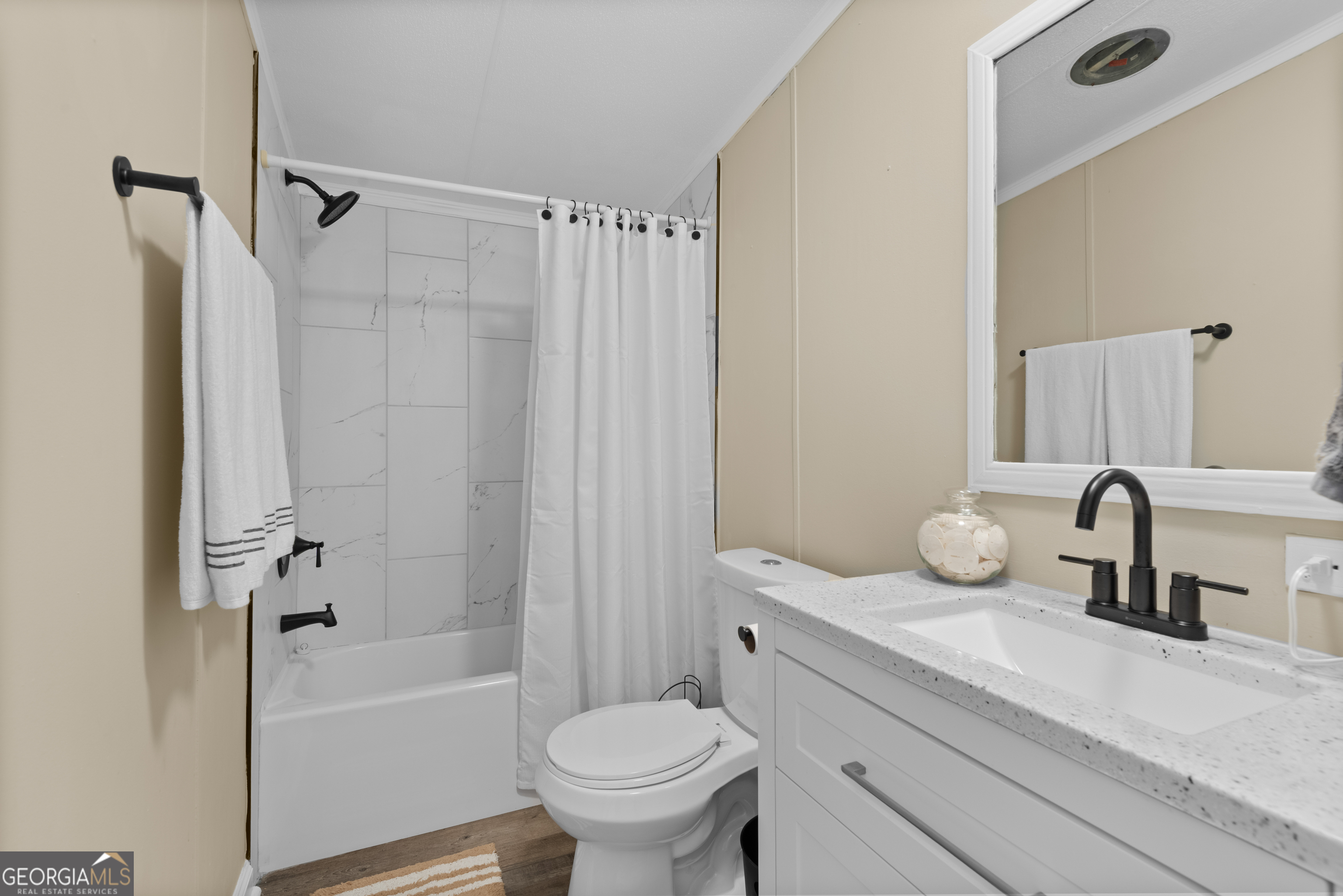 1706 Stark Road Jackson, GA 30233 - Photo 31 of 38 a bathroom with a sink toilet and shower