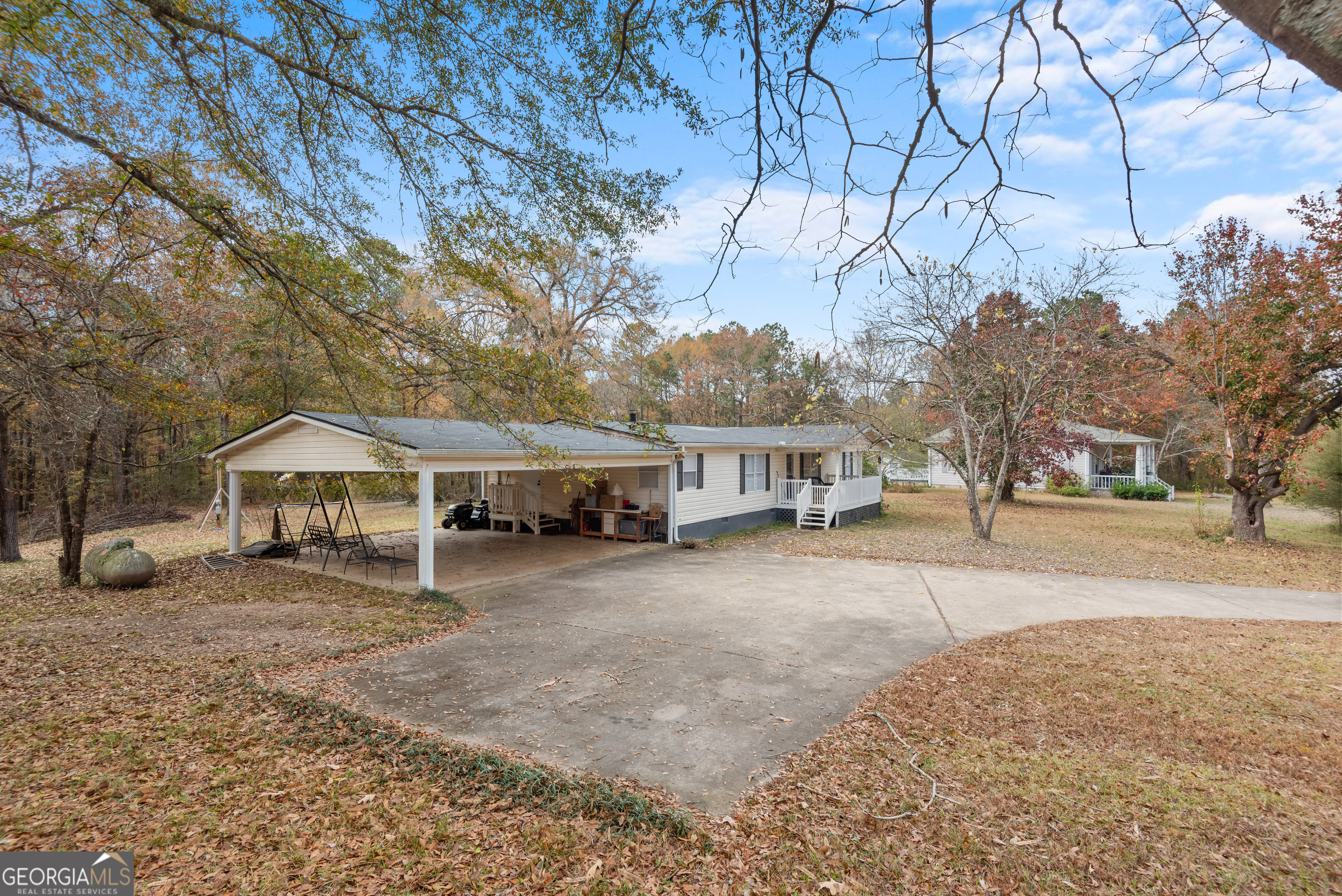 1706 Stark Road Jackson, GA 30233 - Photo 5 of 38 a front view of a house with a yard and garage