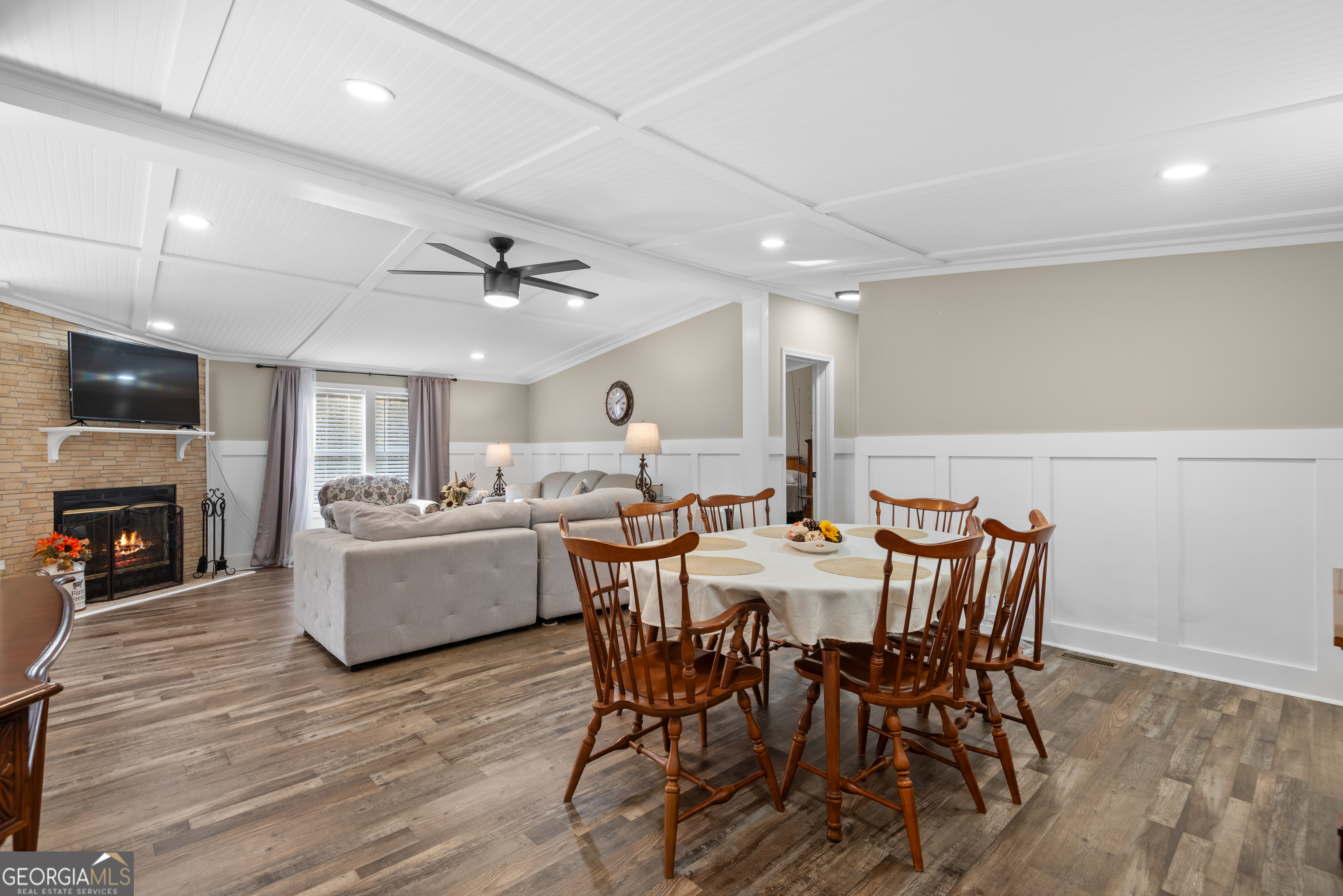 1706 Stark Road Jackson, GA 30233 - Photo 8 of 38 a view of a dining room with furniture a fireplace and wooden floor