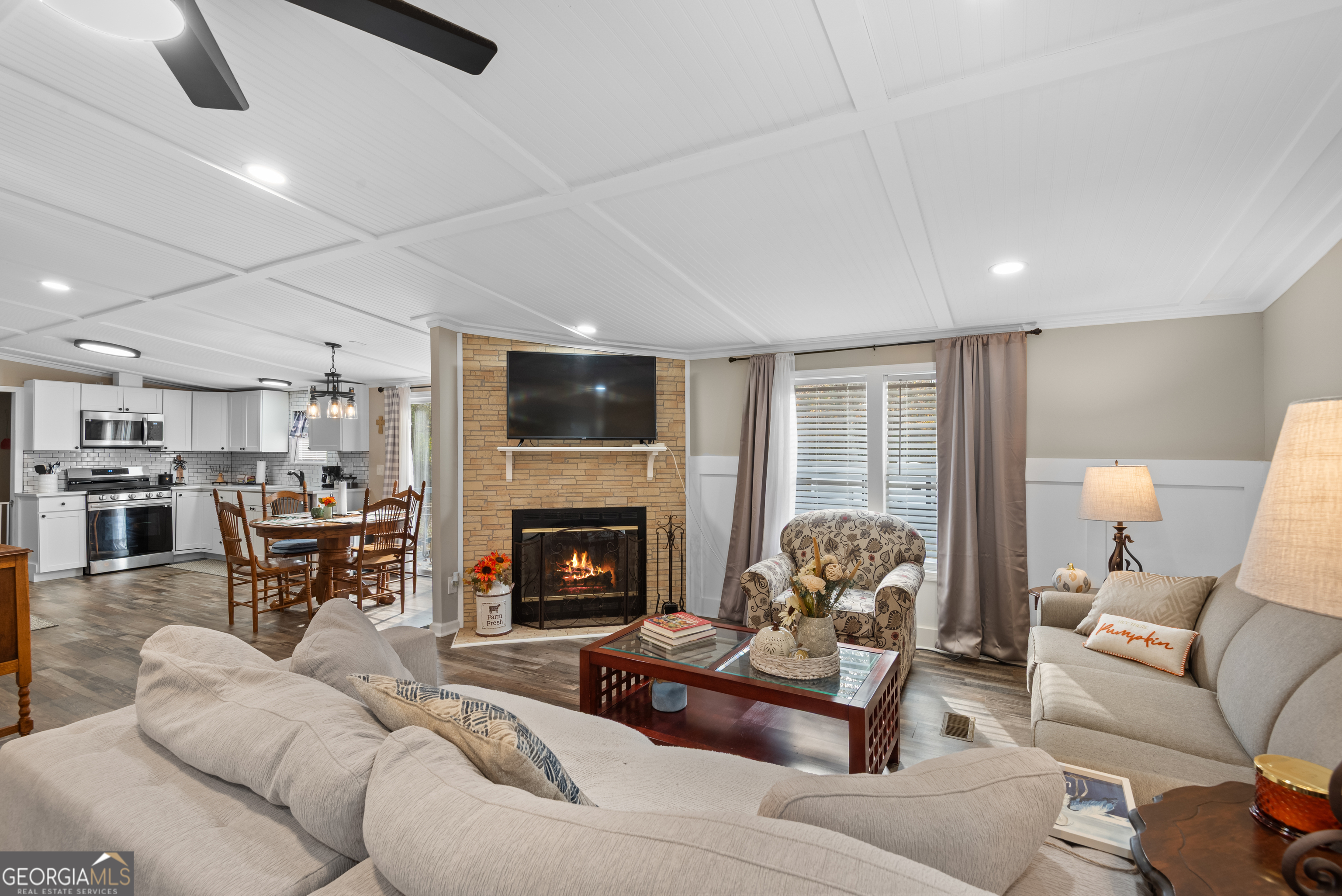 1706 Stark Road Jackson, GA 30233 - Photo 10 of 38 a living room with furniture and a fireplace