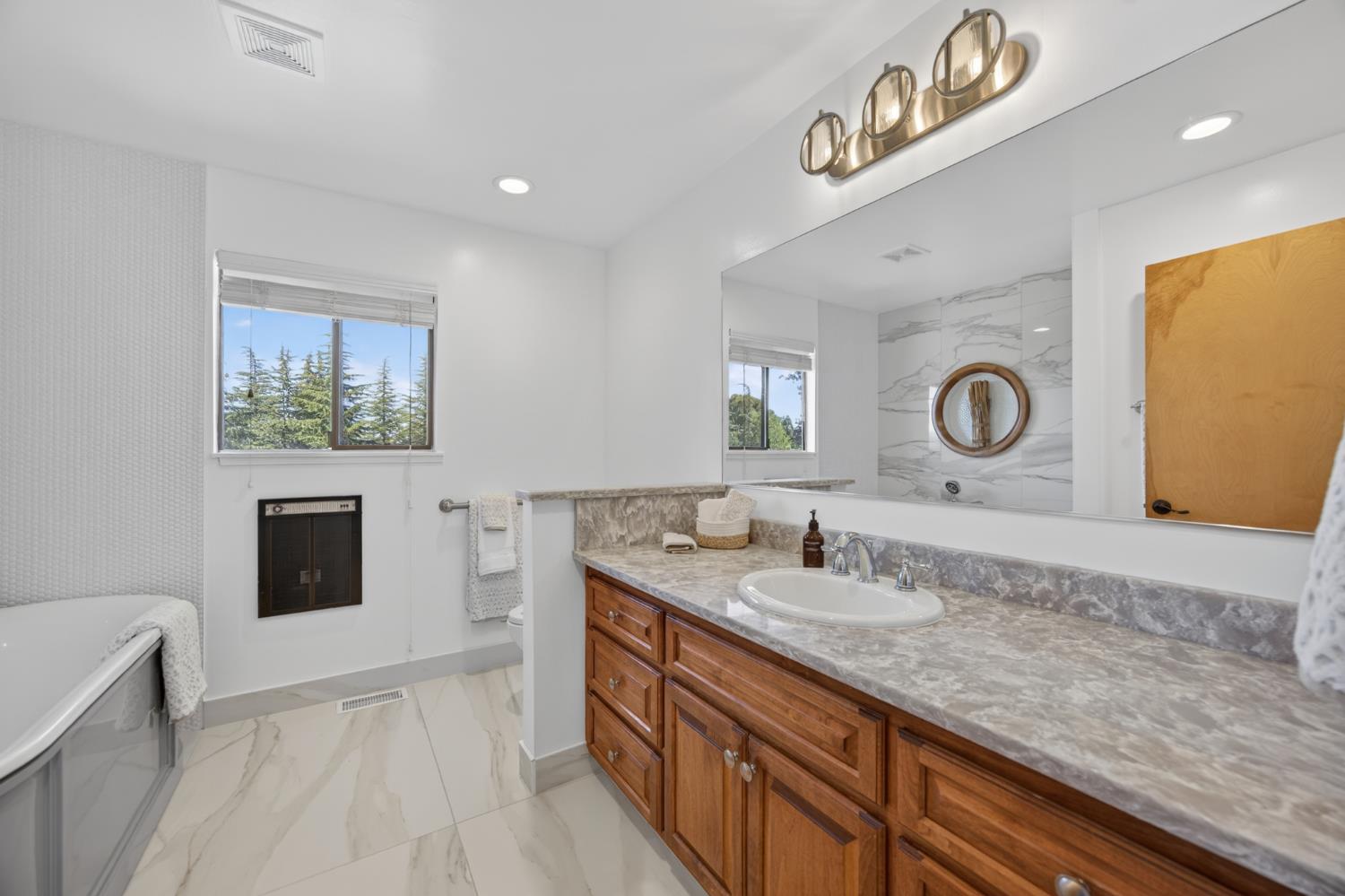 5560 Ralston Way Placerville, CA 95667 - Photo 22 of 78 Spacious guest/hall bathroom featuring a large freestanding soaking tub, and Toto Toilet!