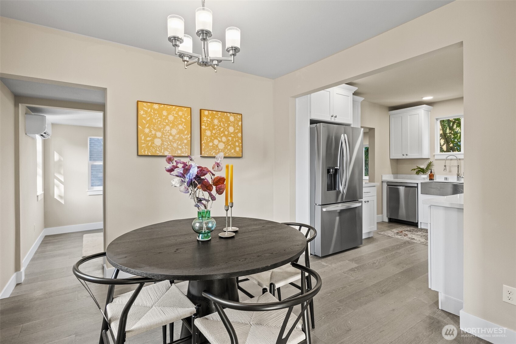 9547 Wallingford Avenue North Seattle, WA 98103 - Photo 12 of 39 a view of a dining room with furniture and a chandelier