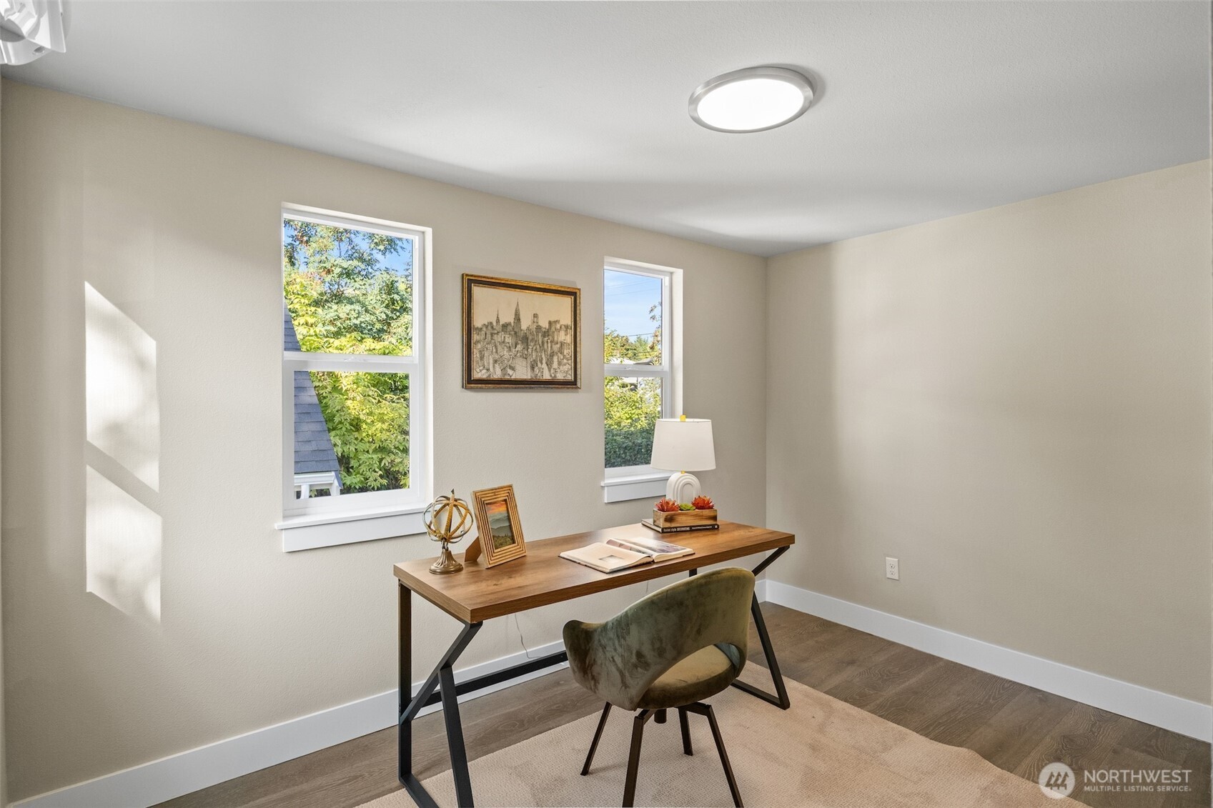 9547 Wallingford Avenue North Seattle, WA 98103 - Photo 13 of 39 a view of a workspace with furniture and a window