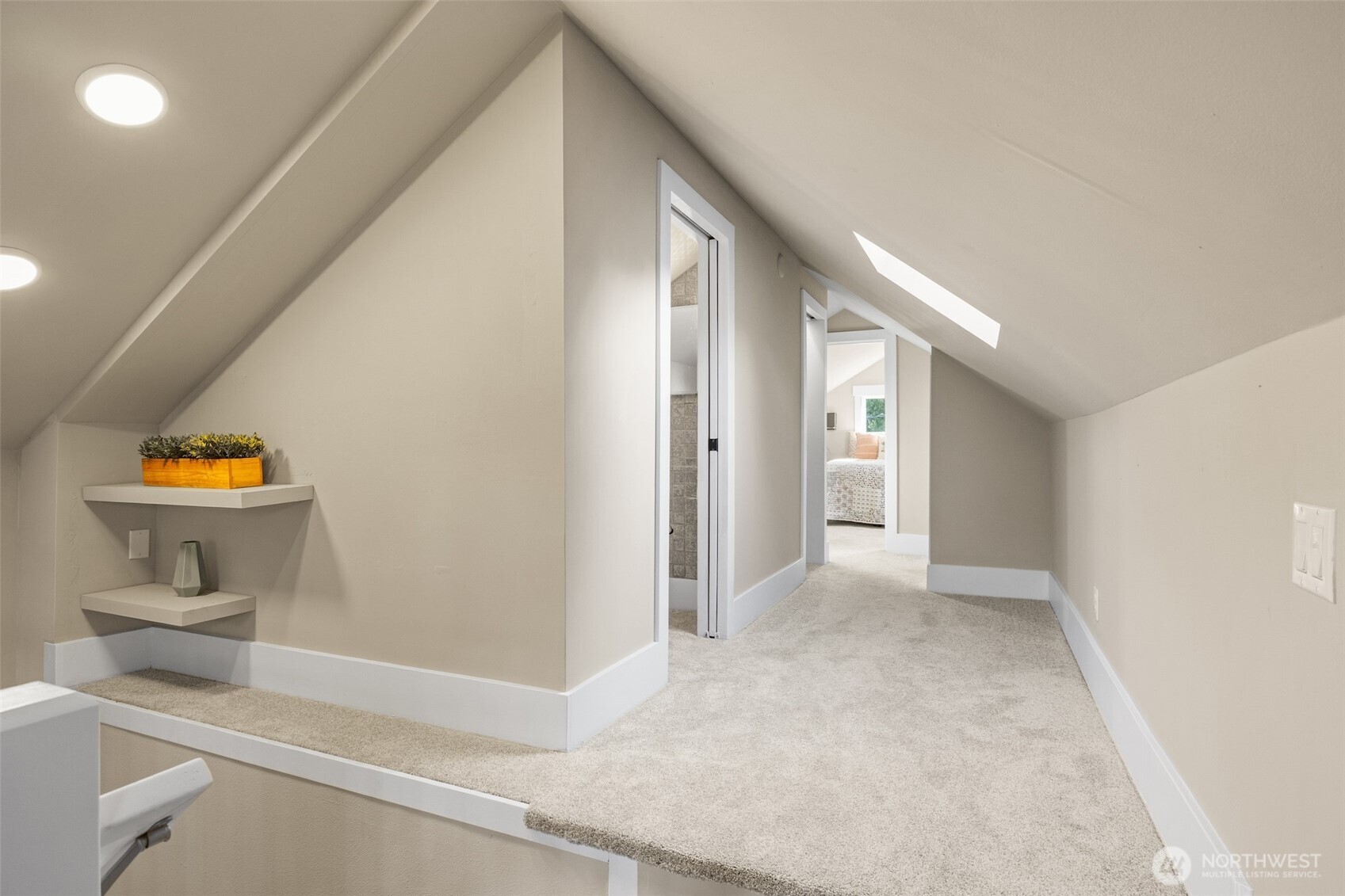 9547 Wallingford Avenue North Seattle, WA 98103 - Photo 21 of 39 a view of a hallway to room with wooden floor and windows
